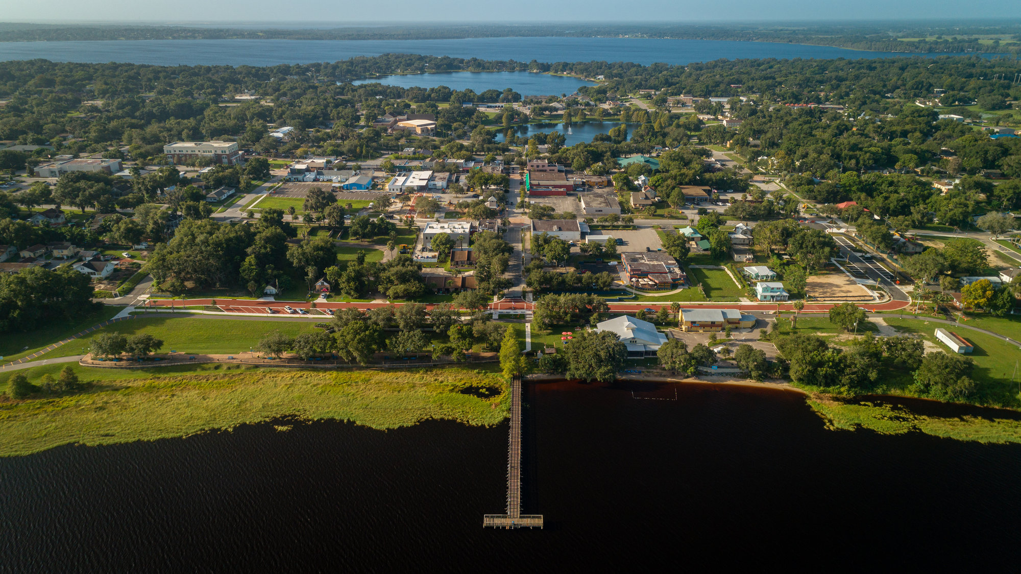 drone shot of downtown clermont off of lake minneola